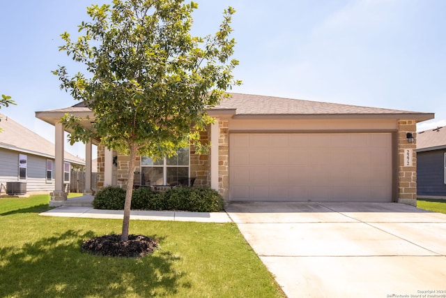 view of front facade with central air condition unit, a front lawn, and a garage