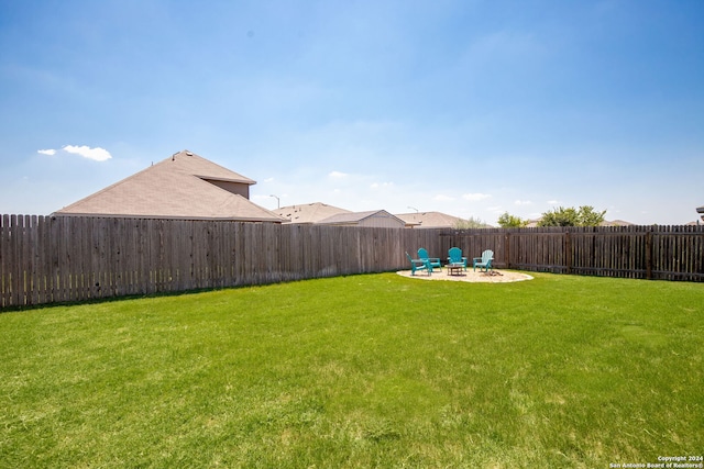 view of yard featuring a patio area and a fire pit