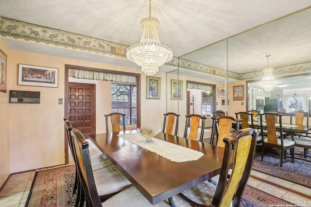 dining space featuring light tile patterned floors, a textured ceiling, and an inviting chandelier