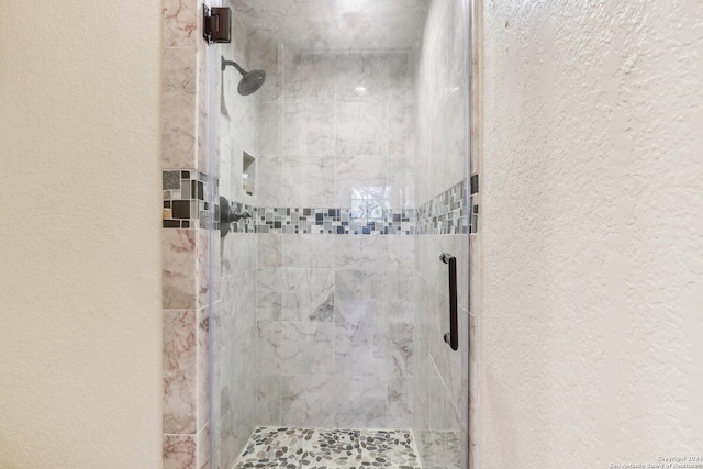 bathroom featuring an enclosed shower