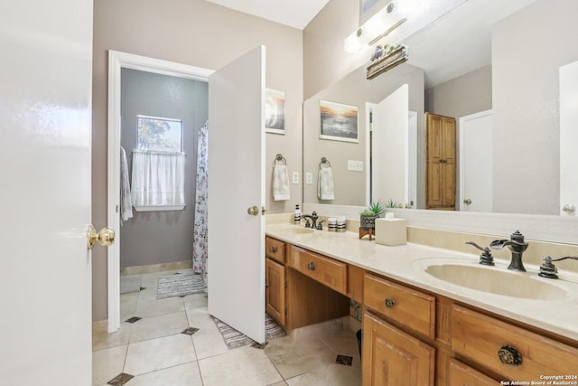 bathroom featuring tile patterned flooring and vanity