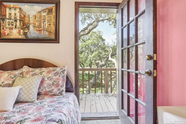 carpeted bedroom with multiple windows