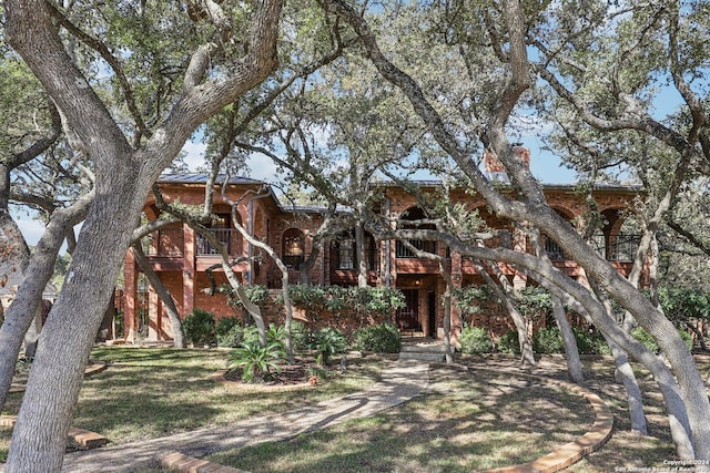 view of property hidden behind natural elements