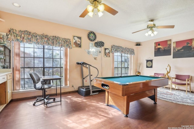 game room with hardwood / wood-style flooring, ceiling fan, a textured ceiling, and pool table