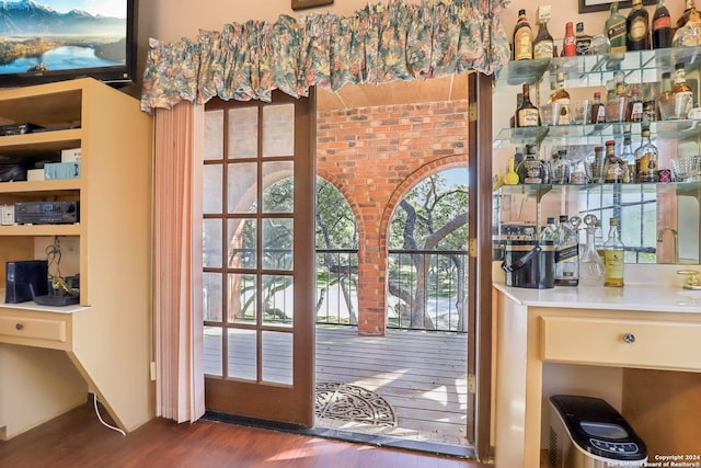 doorway to outside with dark hardwood / wood-style floors