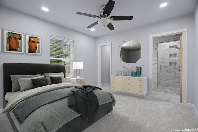 carpeted bedroom featuring connected bathroom and ceiling fan