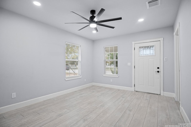 entryway with ceiling fan and light hardwood / wood-style floors