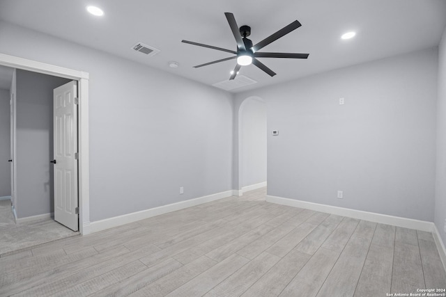 unfurnished room with ceiling fan and light hardwood / wood-style floors