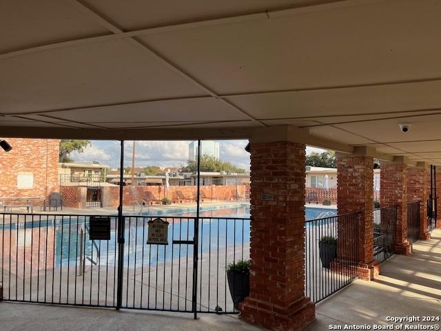 view of pool featuring ornate columns