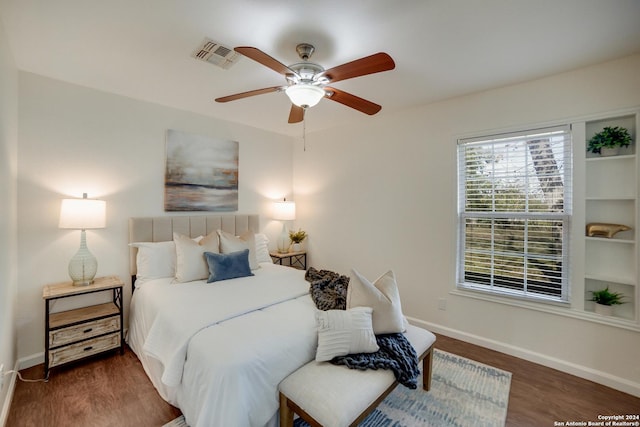 bedroom featuring ceiling fan and dark hardwood / wood-style flooring