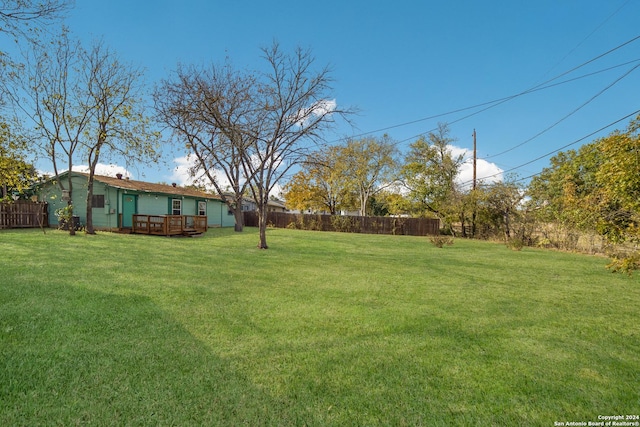 view of yard with a wooden deck