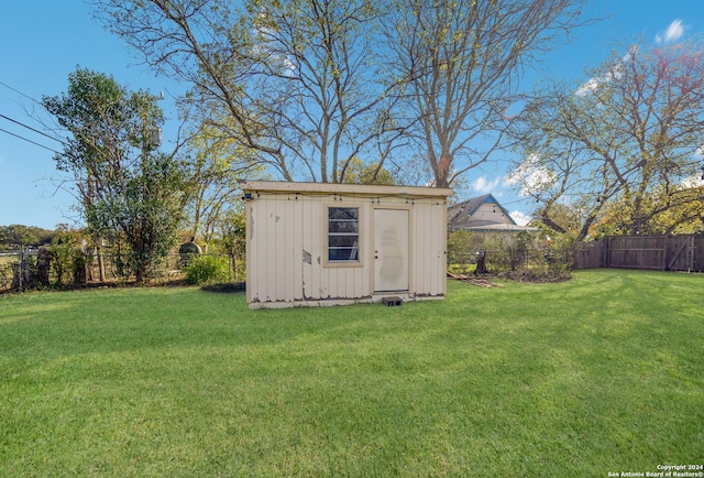 view of outdoor structure with a lawn