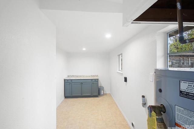 laundry area with water heater