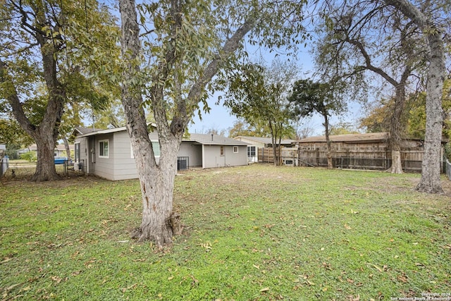 view of yard with central AC unit