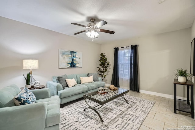 tiled living room with ceiling fan