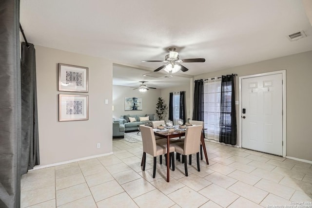 dining area with light tile patterned floors and ceiling fan