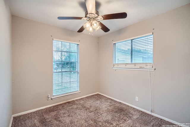 carpeted empty room with ceiling fan