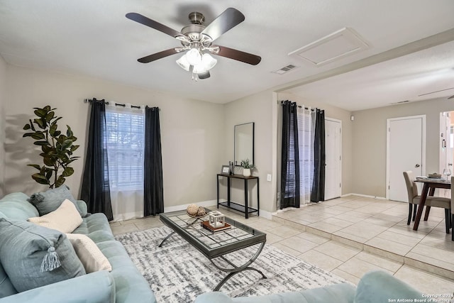 living room featuring ceiling fan and light tile patterned flooring