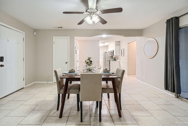 dining room with ceiling fan and light tile patterned floors