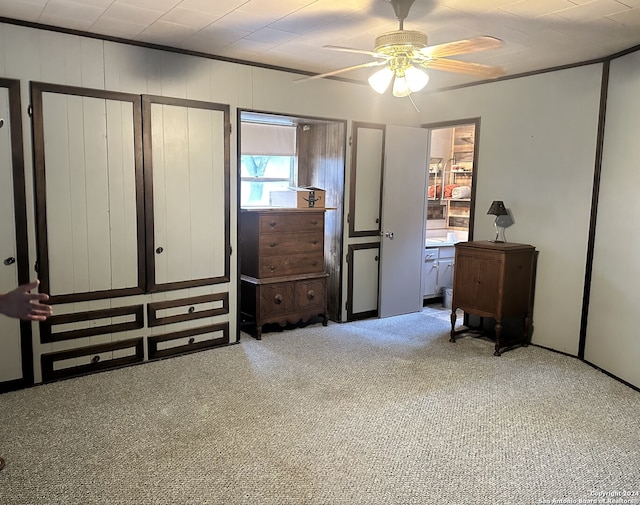 bedroom with light carpet and ceiling fan