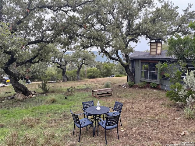 1306 Canyon Trce, Canyon Lake, TX 78133 - view of yard with outdoor dining space