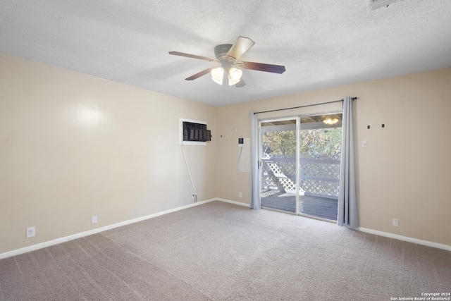 carpeted spare room featuring a wall mounted AC, a textured ceiling, and ceiling fan