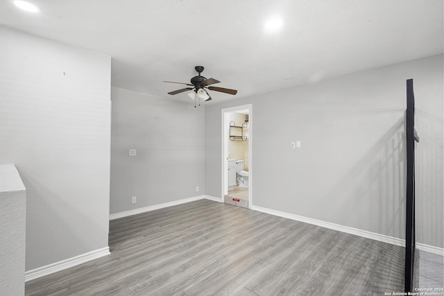 empty room featuring light hardwood / wood-style floors and ceiling fan