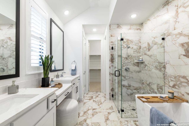 bathroom featuring vanity, lofted ceiling, and independent shower and bath