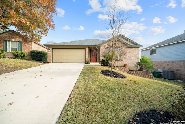 ranch-style home with a garage, a front yard, and central AC unit