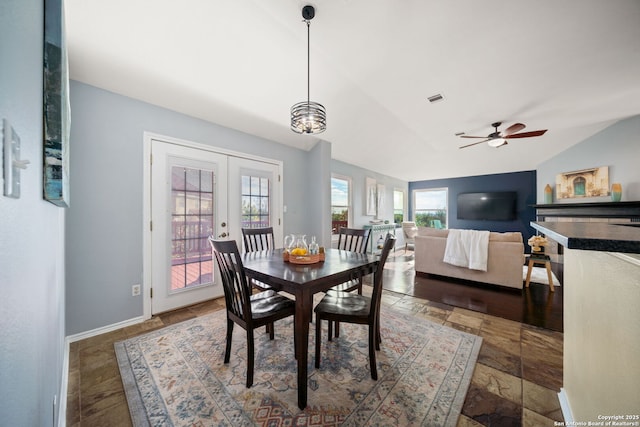 dining area featuring vaulted ceiling, ceiling fan, and french doors