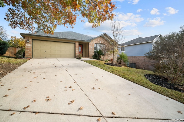 ranch-style home featuring a front lawn and a garage