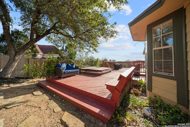 wooden terrace featuring an outdoor living space