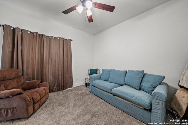 carpeted living room featuring vaulted ceiling and ceiling fan