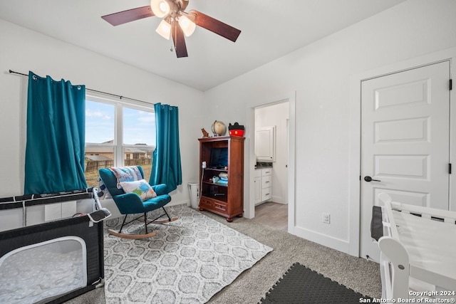 carpeted office with ceiling fan