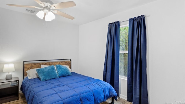 bedroom featuring ceiling fan and hardwood / wood-style flooring