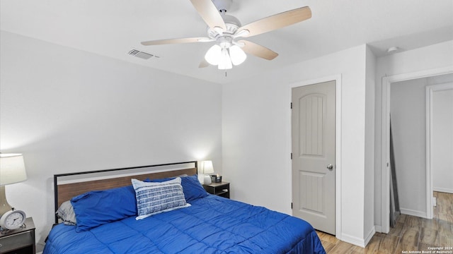 bedroom with ceiling fan and light wood-type flooring