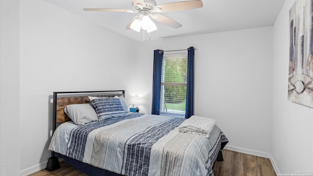 bedroom featuring hardwood / wood-style floors and ceiling fan