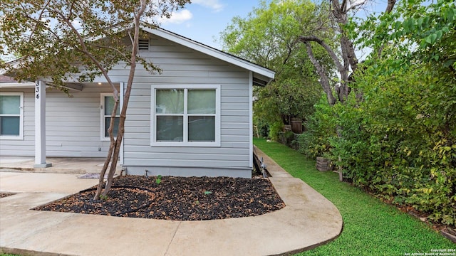 view of side of home featuring a patio area