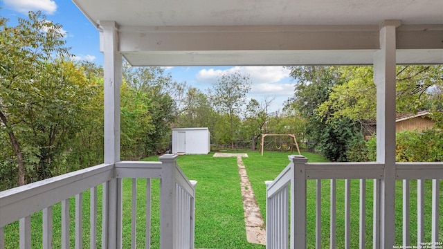 view of yard with a playground and a shed