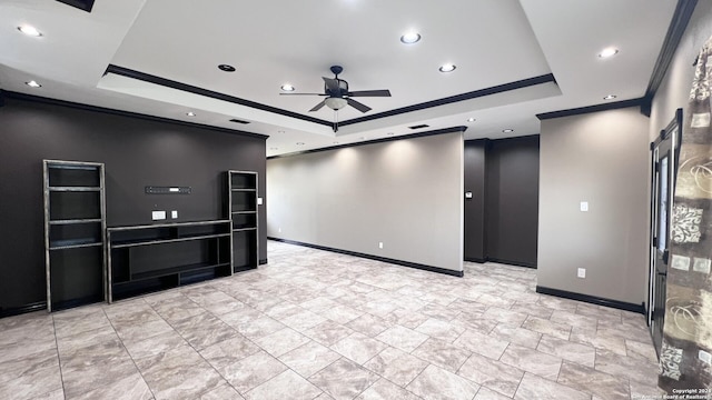 empty room with ceiling fan, crown molding, and a tray ceiling