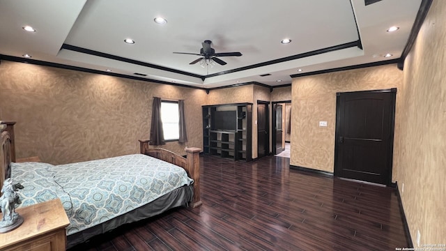 bedroom featuring a raised ceiling, ceiling fan, and dark hardwood / wood-style flooring