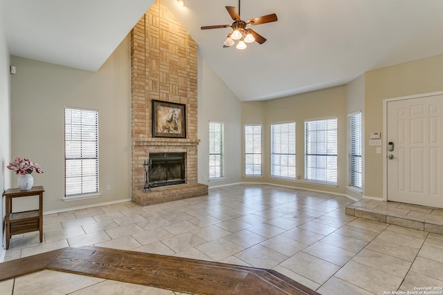 unfurnished living room featuring ceiling fan, light tile patterned floors, high vaulted ceiling, and a brick fireplace