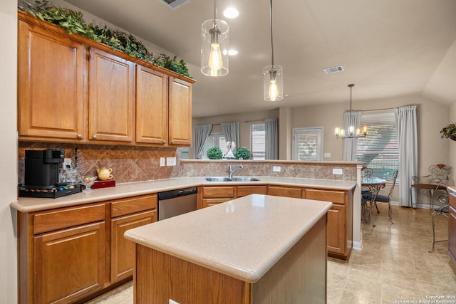 kitchen featuring sink, pendant lighting, dishwasher, a chandelier, and a kitchen island