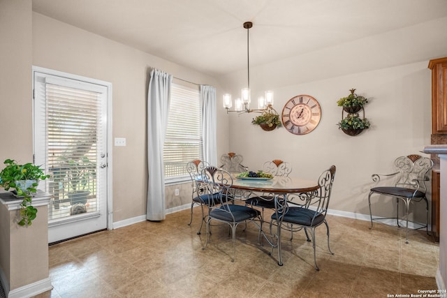 dining room featuring plenty of natural light and an inviting chandelier