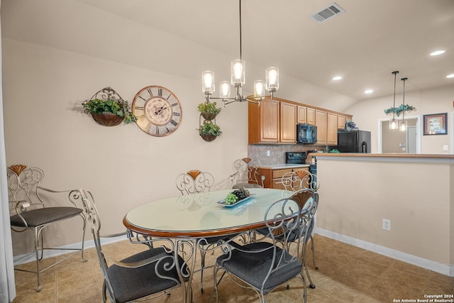 dining room with light tile patterned floors, a chandelier, and lofted ceiling