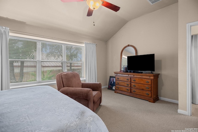 carpeted bedroom with vaulted ceiling and ceiling fan