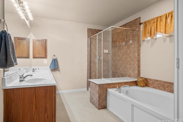 bathroom with vanity and separate shower and tub