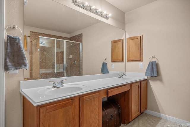 bathroom featuring tile patterned flooring, vanity, and an enclosed shower