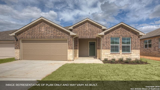 view of front of house with a front lawn and a garage