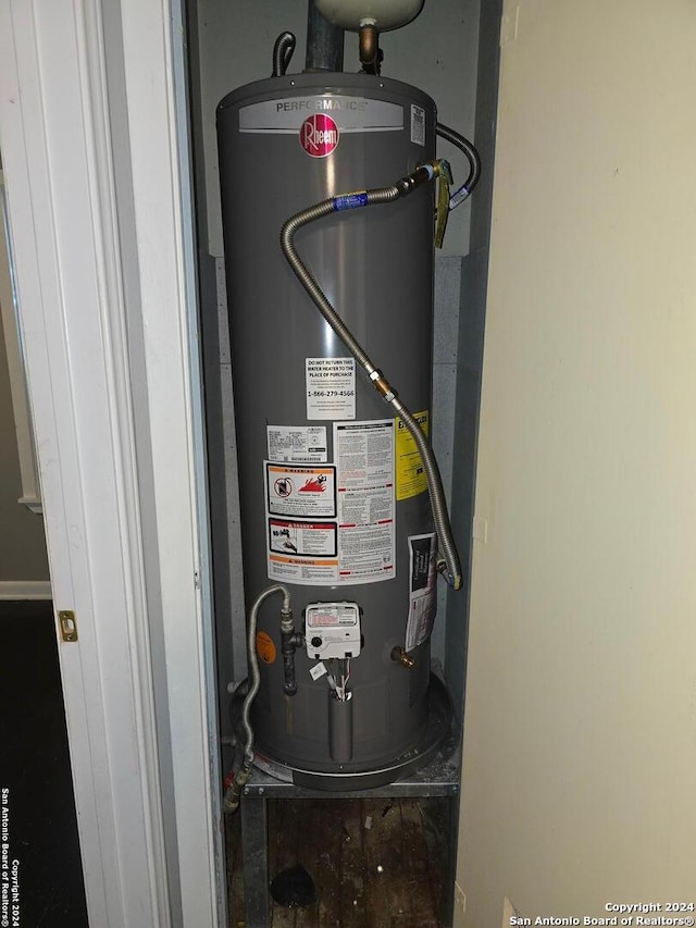 utility room featuring gas water heater